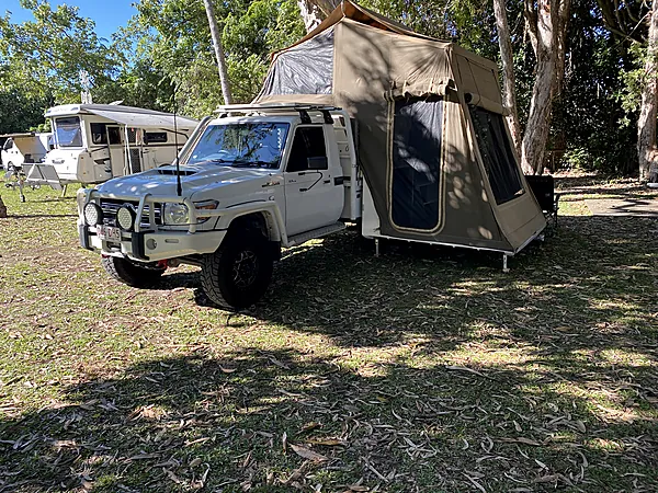 79 Series LandCruiser with Travelander rooftop tent deployed at camp